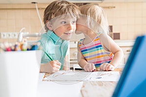 Covid lockdown - boy and girl learn to draw online during self-isolation