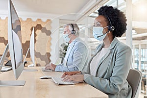 Covid, masks and call center agents in compliance working as a team on customer service in an office typing. Computer