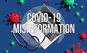 Covid-19 Misinformation theme with stethoscope and laptop photo