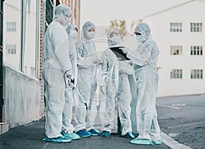 Covid, pandemic and healthcare team wearing protective ppe to prevent virus spread at a quarantine site. First