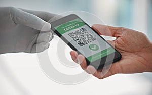 Covid passport, QR code and travel restrictions with a phone in the hands of people waiting in airport. Healthcare