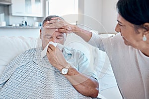 Covid, tissue and healthcare with a man sick at home with his wife taking care of him in the living room. Medical