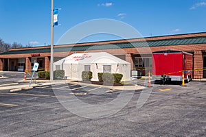 COVID-19 triage tent set up in parking lot of small rural hospital. Rural hospitals like this one 42 beds will be hard pressed t