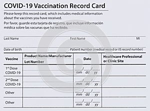 Covid 19 vaccination record card in both English and Spanish languages. Individual record for use during the covid 19 coronavirus