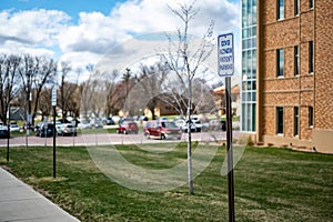 COVID vaccination site with sign and empty parking