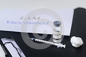 Covid19 coronavirus vaccine bottles and syringe injection tools for covid-19 immunization with text background , I am vaccinated