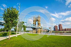 The Covington skyline and John A. Roebling Suspension Bridge, seen from Smale Riverfront Park, in Cincinnati, Ohio photo