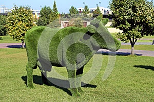 Cow figure made of artificial grass