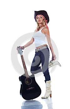 Cow-girl holding an acoustic guitar