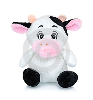 Cow plushie doll isolated on white background with shadow reflection. Cow plush stuffed puppet on white backdrop. Cow toy.