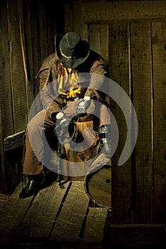 Cowboy with Black Leather Flogging Whip photo