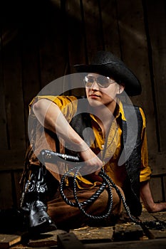 Cowboy with Black Leather Flogging Whip photo