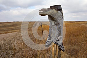 Cowboy Boot on a Fence Post