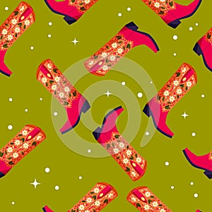 Cowboy boots with flowers and hearts on vibrant green background, seamless pattern. Cute festive repeat pattern. Bright colorful