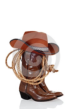 Cowboy boots with hat and a lasso