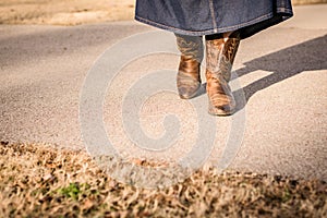 Cowboy Boots Walking Forward in Afternoon Sunlight