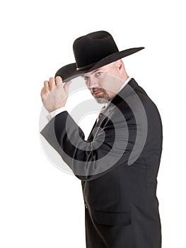 Cowboy businessman tipping hat