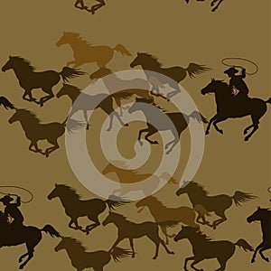 Cowboy chasing a herd of wild mustang horses