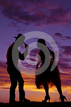 Cowboy couple silhouette man hand on hat