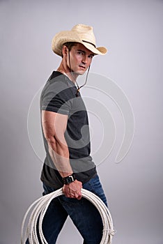 The cowboy gives a smouldering look.