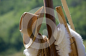 Cowboy Hat hanging on wooden post