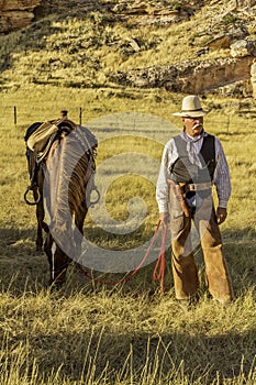 Cowboy by his Horse.