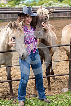 cowboy lady hugs two