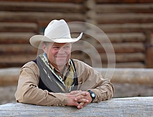 Cowboy Leaning on Fence photo