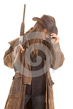 Cowboy long hair rifle over shoulder head down