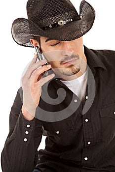 Cowboy on phone eyes closed