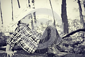 Cowboy Playing on Tree Trunk