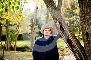 Cowboy Rancher in Forest at Tree