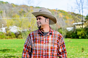 Cowboy Rancher Looking to side and smiling photo