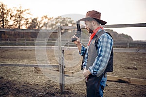 Cowboy with revolver, gunfight in gesert valley