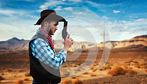 Cowboy with revolver, gunfight in gesert valley