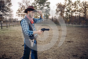 Cowboy with revolver, gunfight on ranch, western