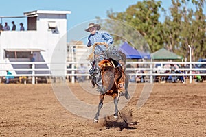 BOWEN RIVER, QUEENSLAND, AUSTRALIA - JUNE 10TH 2018: Cowboy competing in the Saddle Bronc event at Bowen River country rodeo
