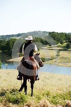 Cowboy riding his horse