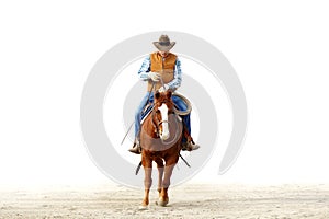 A cowboy riding his horse, isolated white backgrou photo
