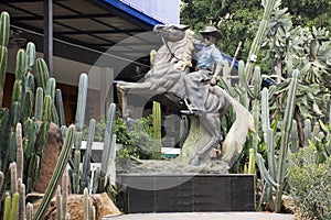 Cowboy riding horse statues for show at outdoor in Saraburi, Thailand