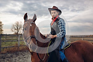 Cowboy riding a horse on texas farm