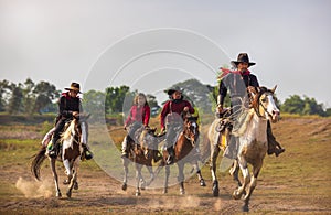 Cowboy`s way of life include riding a horse around locales photo