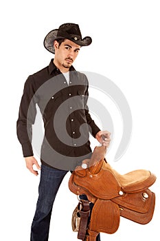 Cowboy serious with saddle