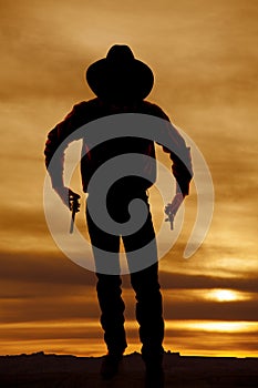 Cowboy silhouette two guns