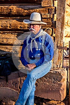 Cowboy Sitting at the Barn photo
