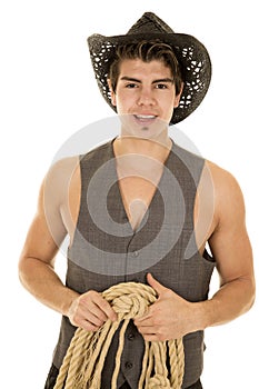 Cowboy in vest with rope in hands