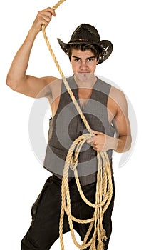 Cowboy in vest with rope over head