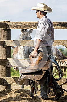 Cowboy walking and watching photo