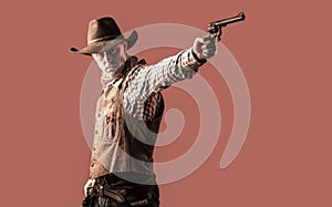 Cowboy with weapon on red background. American bandit in mask, western man with hat. West, guns. Portrait of a cowboy