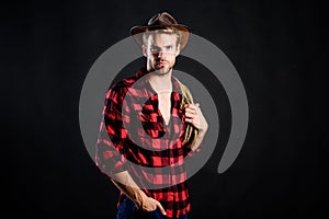 Cowboy wearing hat hold rope. Lasso tool of American cowboy. Still used on ranches to capture cattle or other livestock